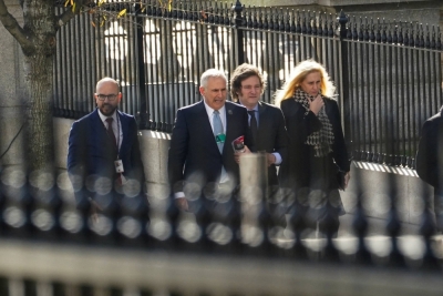 Argentine President-elect Javier Milei and his delegation arrive for meetings at the White House in Washington on Tuesday.