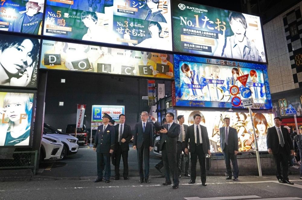 National Police Agency Commissioner-General Yasuhiro Tsuyuki and other officials inspect Tokyo's Kabukicho district on Monday.