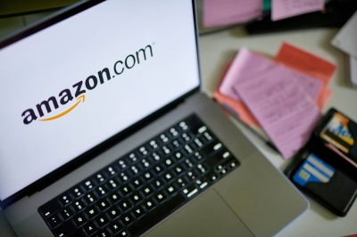 The Amazon.com logo on a laptop. The online retailer has announced the launch of its own AI chatbot, Q.