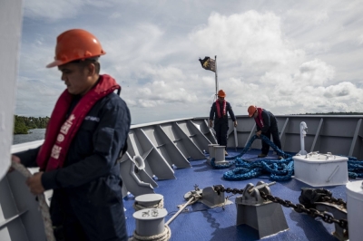 Philippine Coast Guard personnel patrol the South China Sea