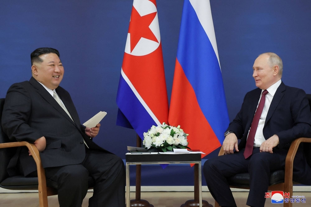 North Korean leader Kim Jong Un and Russian President Vladimir Putin attend a meeting at the Vostochny Cosmodrome in Russia's far eastern Amur region on Sept. 13.