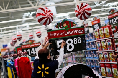 A Walmart worker organizes products for the Christmas season in 2016. 