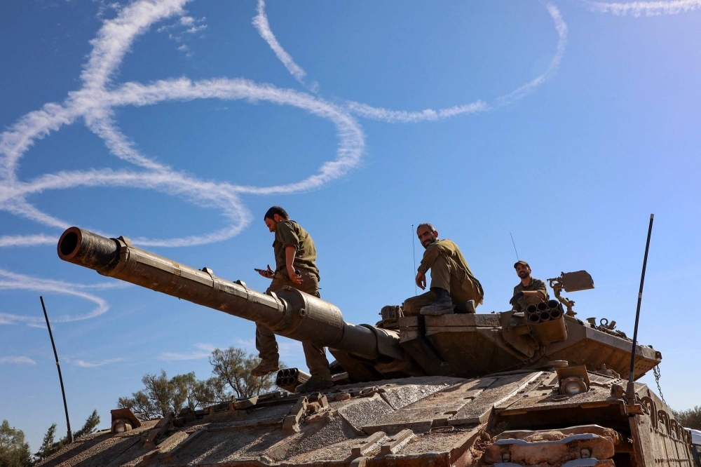Israeli troops gather on the border with the Gaza Strip on Thursday, the 7th day of a truce with Hamas.