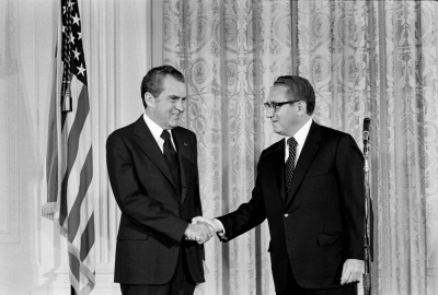 Henry Kissinger, alongside U.S. President Richard Nixon, is sworn in as secretary of state on Sept. 22, 1973.