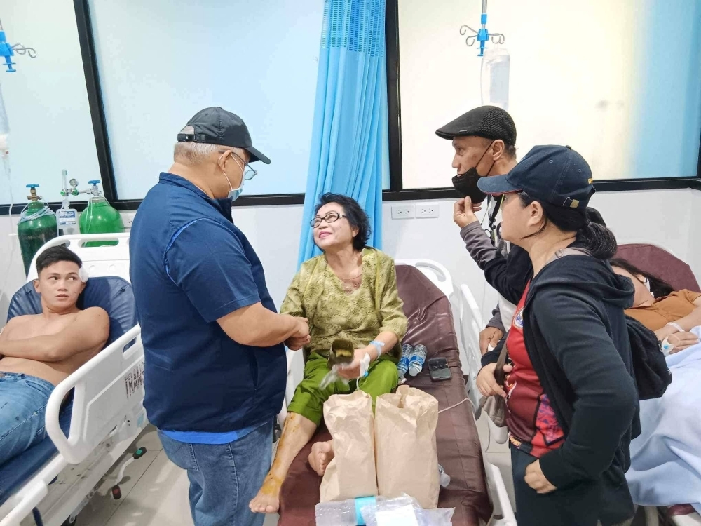 Lanao del Sur Gov. Mamintal Adiong Jr. visits wounded victims of an explosion that happened during a Catholic Mass in a gymnasium at Mindanao State University, in Marawi, the Philippines, on Sunday.  