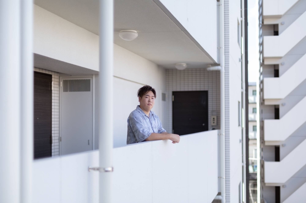 Yuuki Matsumoto, formerly Yuni, at his residence in Yokohama on Aug. 24. Japanese children with unconventional names can face societal and practical challenges unique to their country and its written language. Matsumoto, 24, was bullied over his name to the extent he dropped out of school, and had it legally  changed this year. 


