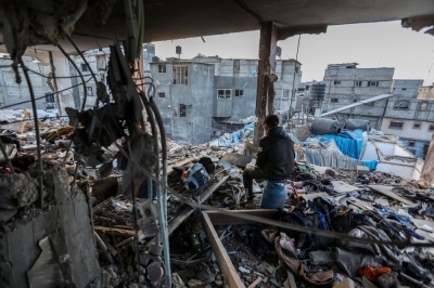 A Palestinian resident inspects the destruction caused by air strikes on their home in Khan Younis, Gaza, on Sunday.