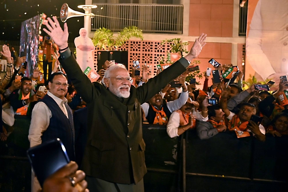 Narendra Modi celebrates at the Bharatiya Janata Party headquarters in New Delhi on Sunday.
