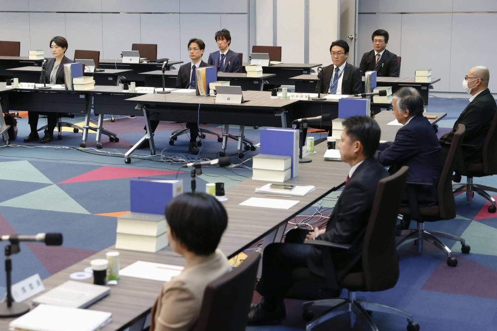 An advisory panel on the digitalization of criminal procedures holds a meeting at the Justice Ministry in Tokyo on Monday.
