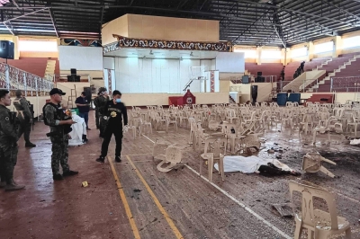 Police inspect the site of a bomb attack inside a gymnasium at Mindanao State University in Marawi, the Philippines, on Sunday. 