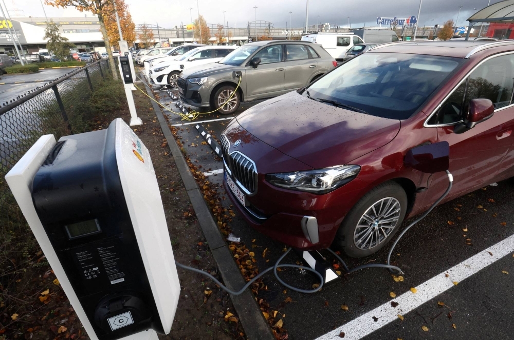 A BMW electric vehicle is charged at a charging station in Drogenbos, Belgium, in November.