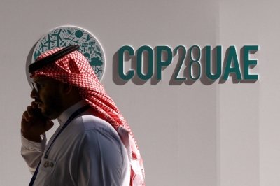 A man talks on the phone during COP28 in Dubai on Monday.