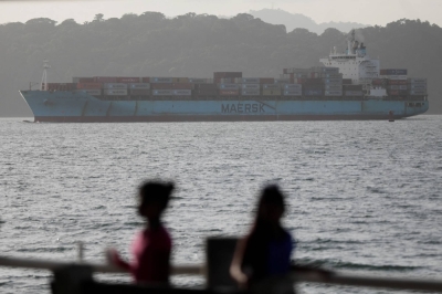 A container ship is seen near the Panama Canal, in Panama City on Saturday.