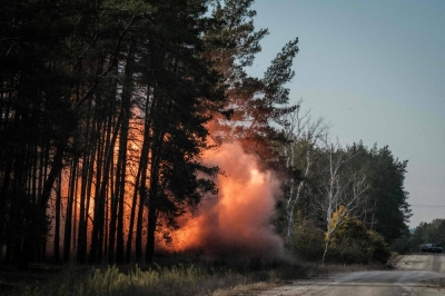 Collected anti-tank mines and explosives are detonated by the Ukrainian national police emergency de-mining team in the Donetsk region on Oct. 6, 2022.