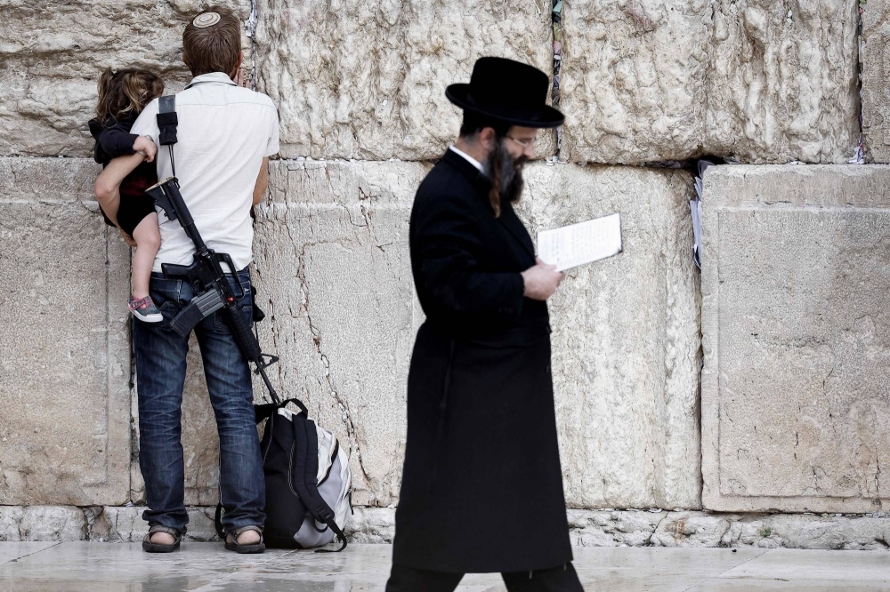 Practioners of Judaism pray at the Western Wall in Jerusalem’s Old City on Nov. 12.