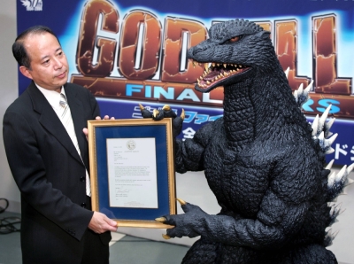Godzilla is presented with a certificate after being selected for Hollywood's Walk of Fame during a news conference in Tokyo in October 2004. 