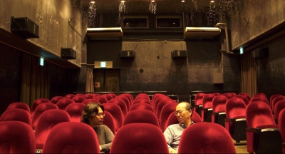 Filmmaker Kah Wai Lim (left) interviews the owners of 22 independent cinemas across Japan about the difficulties and joys of running a “mini-theater” in “This Magic Moment.”