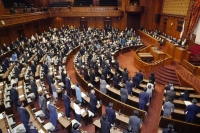 The Upper House plenary session on Wednesday passed the bill to revise the cannabis control law to allow medical use of cannabis. | Kyodo