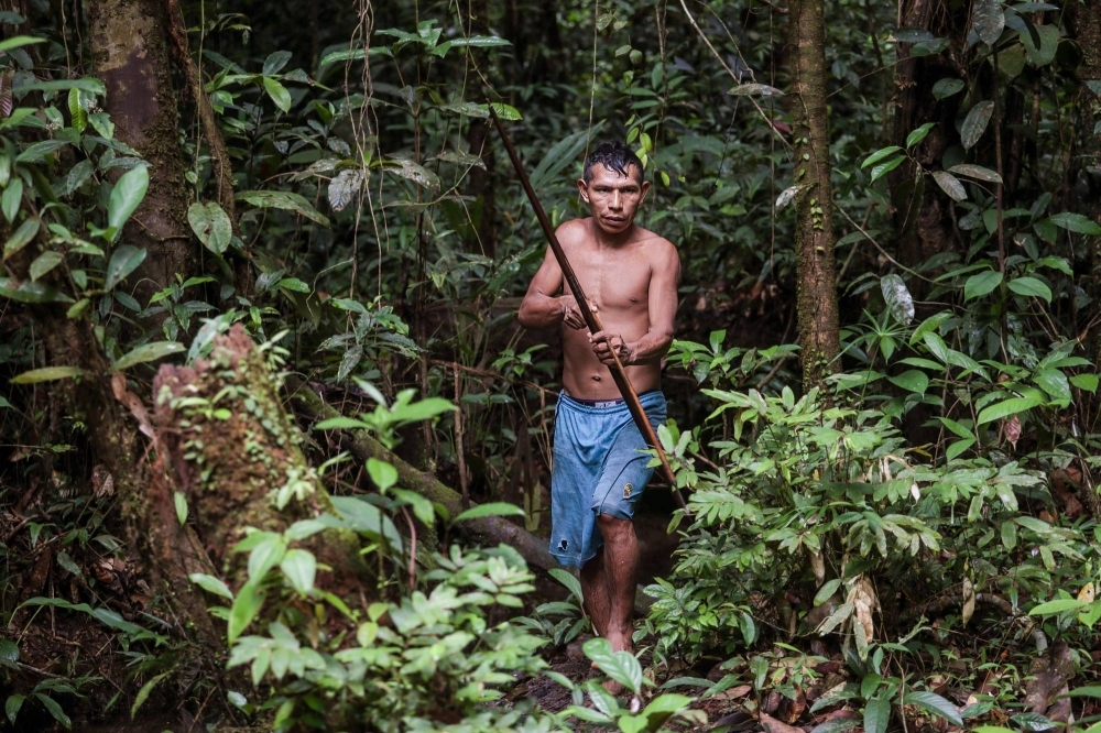 An Indigenous man prepares to hunt near a settlement close to the Pira Parana River, in Vaupes province, Colombia, on Nov. 10.