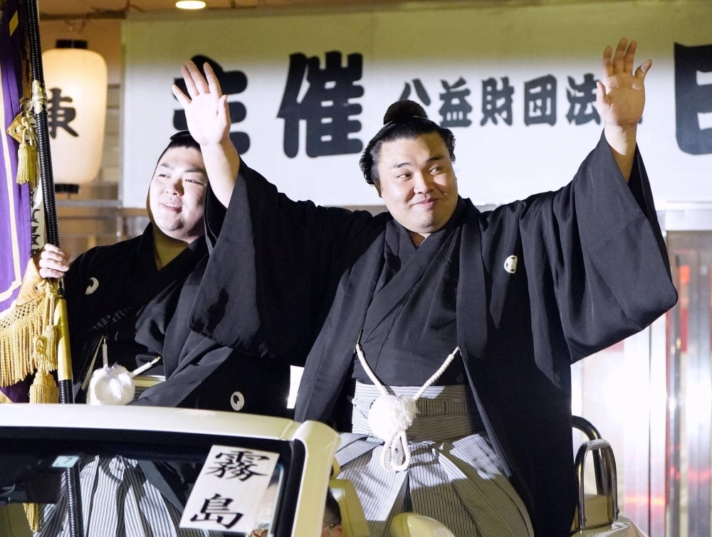 Kirishima waves to fans as he celebrates his second Emperor's Cup, in Fukuoka last month.