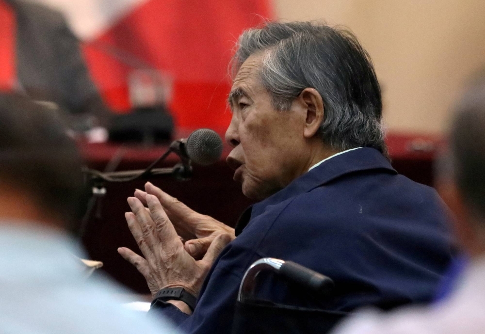 Former Peruvian President Alberto Fujimori attends a trial as a witness at the navy base in Callao, Peru, on March 15, 2018. Picture taken through a window.