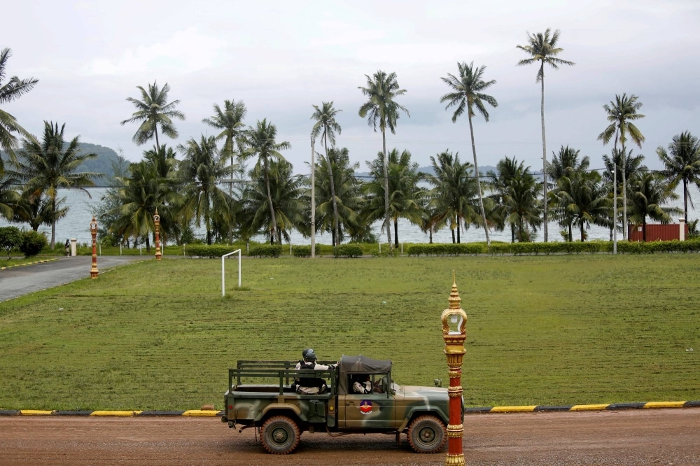 Sailors sit on a truck at the Cambodian Ream Naval Base in Sihanoukville, Cambodia, in 2019. 