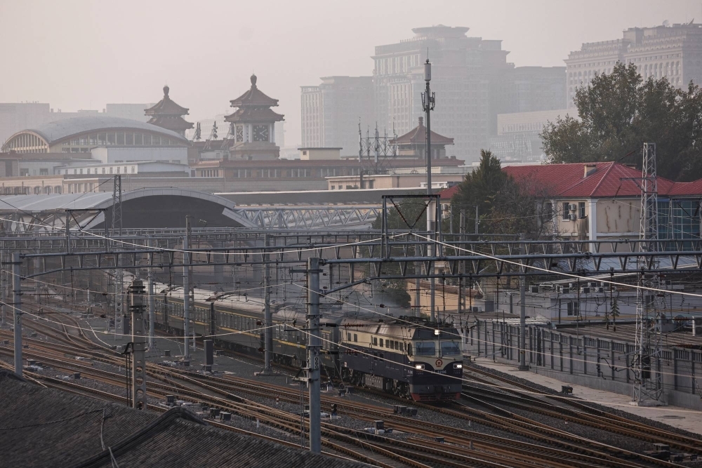 A train passes as Beijing issues an orange alert for heavy air pollution on Oct. 31.