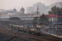 A train passes as Beijing issues an orange alert for heavy air pollution on Oct. 31. | REUTERS