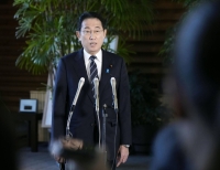 Prime Minister Fumio Kishida speaks to reporters at the Prime Minister's Office on Thursday. | Kyodo