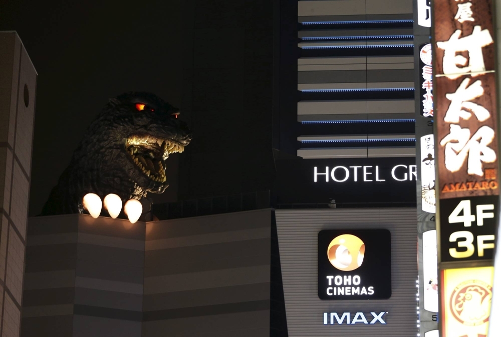 A Godzilla head in Tokyo's Kabukicho district. The latest installment in the franchise, which opened last Friday, follows the giant reptilian monster rampaging through postwar Japan.