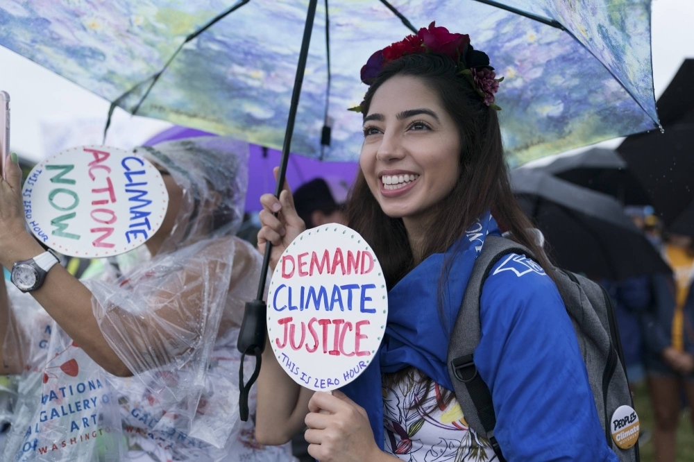 Demonstrators call for action on climate change and environmental justice during a march in Washington in July 2018.