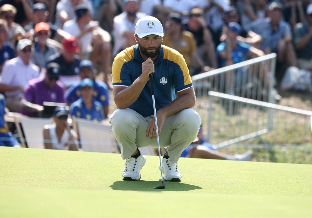 Team Europe's Jon Rahm lines up a putt during the Ryder Cup in Rome in October. The two-time major champion is heading to LIV Golf after signing a mega-deal with the PGA Tour rival. 