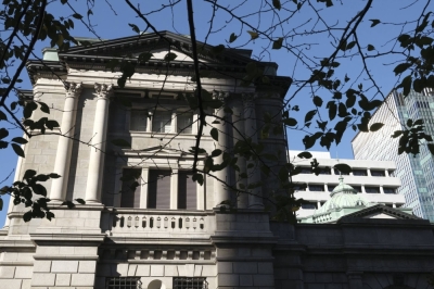 The Bank of Japan headquarters in Tokyo. Half of the 52 economists surveyed by Bloomberg said the central bank will scrap its negative rate in April, up from 29% in the October survey.
