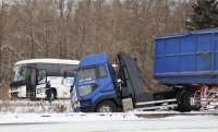 The site in Furano, Hokkaido, where a tractor trailer hit a bus on Friday. Twelve people were injured.  | Kyodo