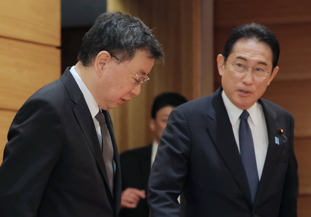 Prime Minister Fumio Kishida and Chief Cabinet Secretary Hirokazu Matsuno attend a Cabinet meeting in Tokyo on Friday.