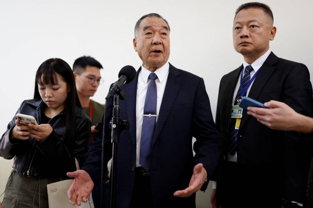 Taiwanese Defense Minister Chiu Kuo-cheng (center) speaks to the media on Friday, a day after a Chinese balloon was spotted crossing the median line of the Taiwan Strait.
