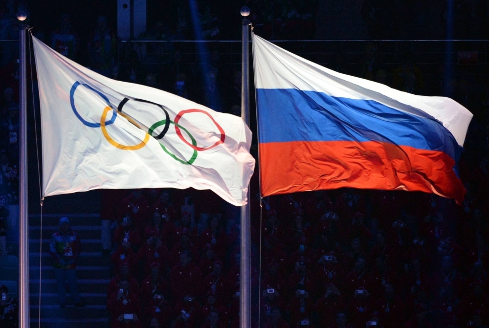 The Olympic and Russian flags during the Opening Ceremony of the 2014 Sochi Winter Games. 