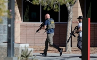 Law enforcement officers head into the University of Nevada, Las Vegas, campus amid a mass shooting on Wednesday.  | Las Vegas Sun / via REUTERS