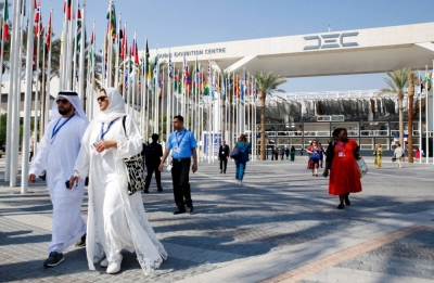 Delegates arrive at Dubai's Expo City during COP28 on Saturday