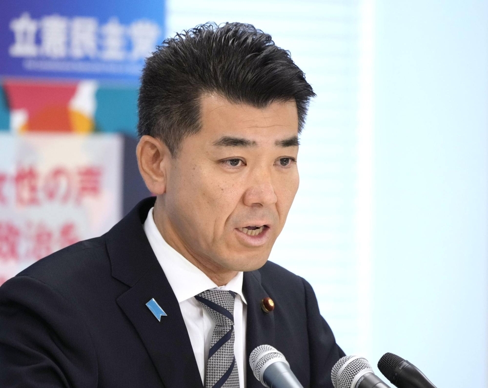 Constitutional Democratic Party of Japan leader Kenta Izumi attends a news conference on Friday in Tokyo. 