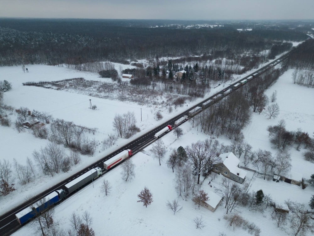 Trucks line up in a queue to cross the Polish-Ukrainian border at the Dorohusk-Jagodzin crossing, in Brzezno, Poland, on Dec. 4.