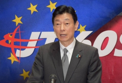 Industry Minister Yasutoshi Nishimura speaks to reporters in the city of Naka, Ibaraki Prefecture, on Sunday.