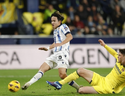 Real Sociedad's Takefusa Kubo (left) scores a goal during the first half of a La Liga match away to Villarreal in Spain on Saturday.