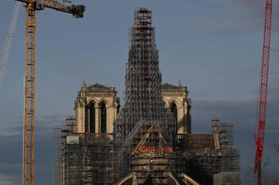 The new spire is being reconstructed to be identical to the original one that was destroyed in a fire in April 2019. The Notre Dame Cathedral is scheduled to reopen on Dec. 8, 2024.