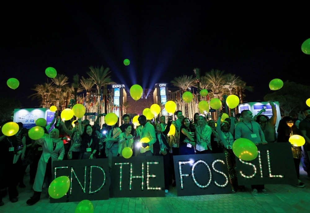 Activists protest at COP28 in Dubai on Monday.