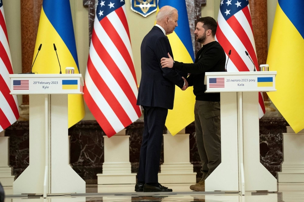 U.S. President Joe Biden shakes hands with Ukrainian President Volodymyr Zelenskyy in Kyiv on Feb. 20.