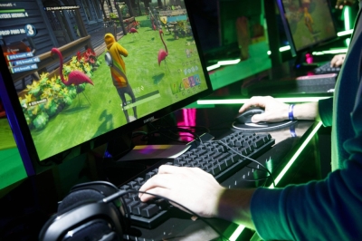 An attendee plays Fortnite, made by Epic Games, during the E3 Electronic Entertainment Expo in Los Angeles in 2019.