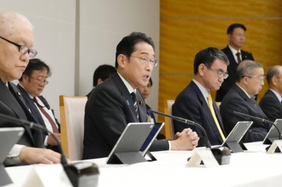 Prime Minister Fumio Kishida addresses a meeting to discuss the results of comprehensive inspection of My Number information held at the Prime Minister's Office on Tuesday.