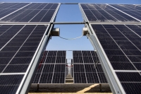 Wiring connects photovoltaic panels at the Al Dhafra Solar project, constructed by Electricite de France (EDF) and Jinko Power Technology, in Abu Dhabi, United Arab Emirates, in January. | Bloomberg

