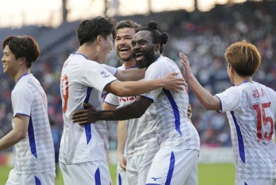 Peter Utaka (second from right) and his Ventforet Kofu teammates celebrate after a goal during the team's away win over Thailand's Buriram United on Tuesday.